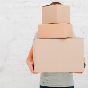 man carrying cardboard boxes