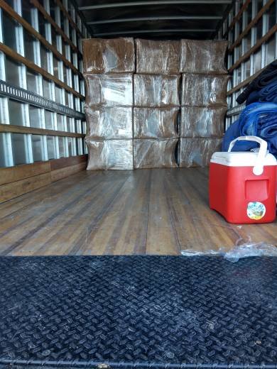plastic wrapped boxes in moving truck
